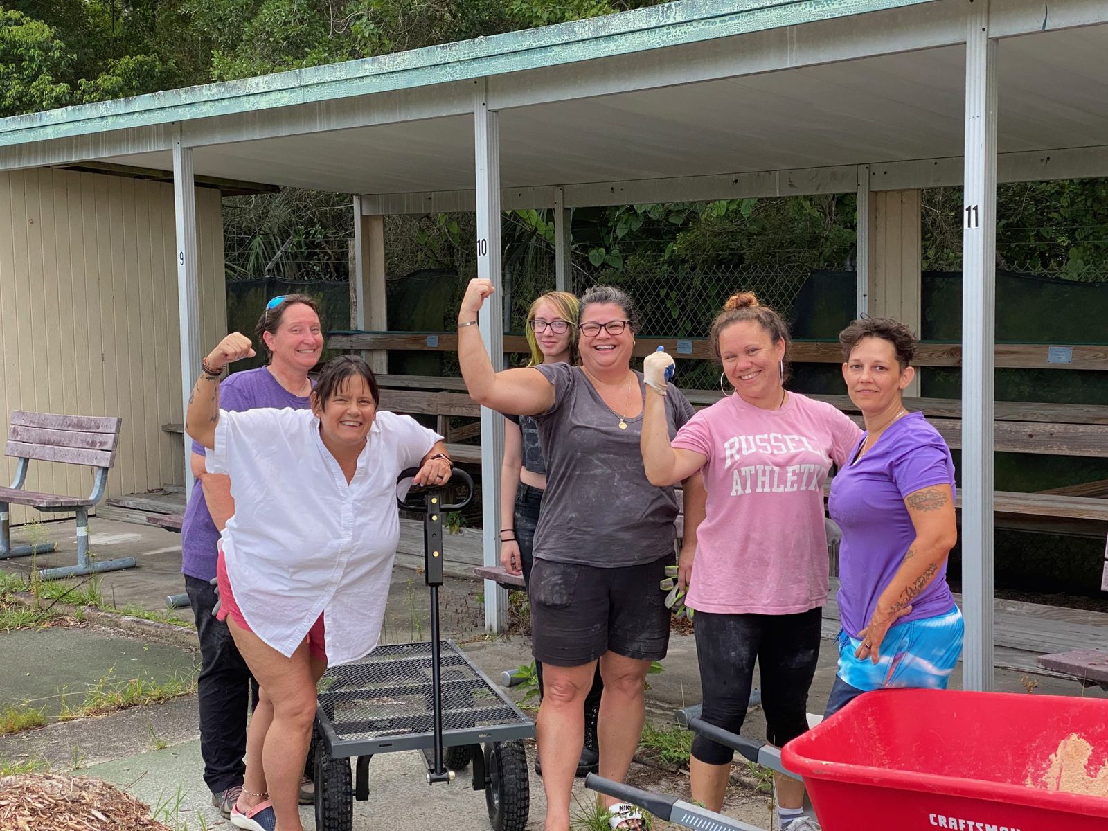 A group of Deltona Strong volunteers celebrating after a workday at the community gardens